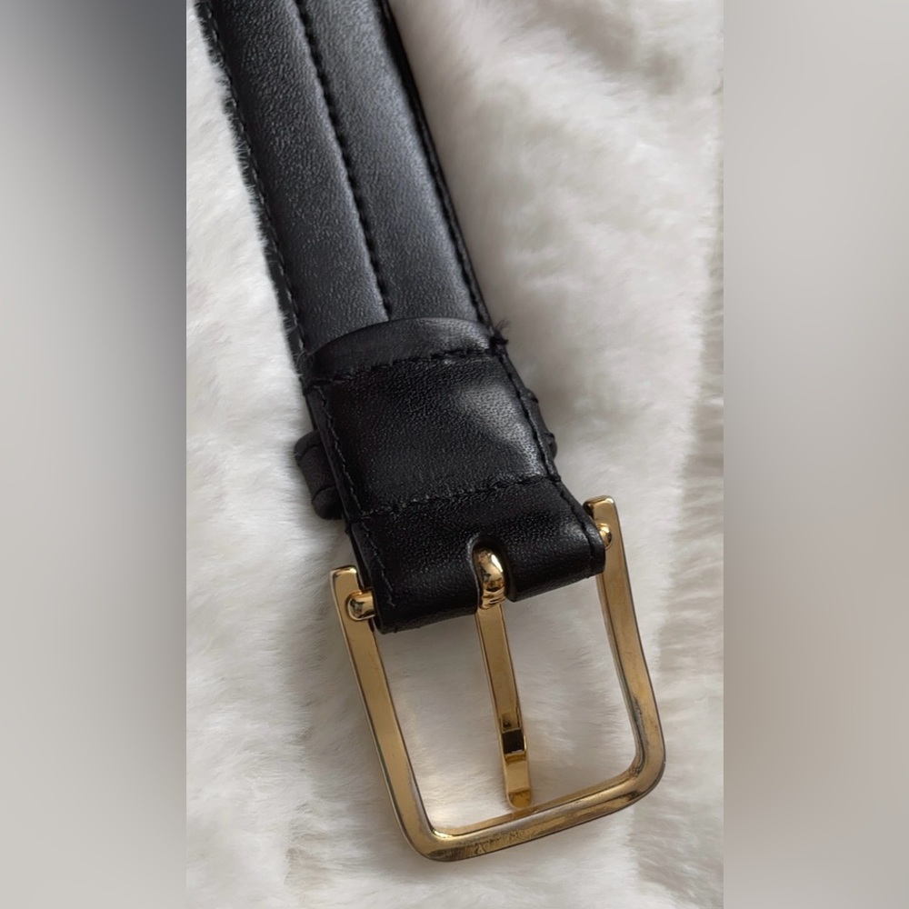 Black men’s belt. Gold buckle.